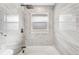 Bathtub with custom tile and modern fixtures at 3437 N Jackson St, Denver, CO 80205