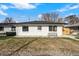 Charming home with a white exterior and well-maintained lawn at 3437 N Jackson St, Denver, CO 80205