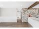 Bright living room with wainscoting and stone accent wall at 3437 N Jackson St, Denver, CO 80205