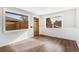 Bright living room featuring large windows, wood floors, and views of the surrounding neighborhood at 3437 N Jackson St, Denver, CO 80205