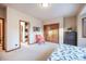 Bedroom featuring a closet, comfortable chair, and views, making it a welcoming retreat at 1220 Scarsbrook Ct, Monument, CO 80132