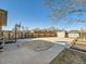 Backyard featuring a concrete patio with a sandbox, basketball hoop, and storage shed at 438 N 11Th Ave, Brighton, CO 80601