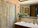 Bathroom with a decorative mirror and a shower-tub combo at 438 N 11Th Ave, Brighton, CO 80601