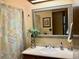 Bathroom with a decorative mirror and a shower-tub combo at 438 N 11Th Ave, Brighton, CO 80601