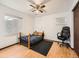 Bedroom featuring a ceiling fan, wood laminate flooring, and a small bed and desk at 438 N 11Th Ave, Brighton, CO 80601