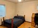 Bedroom with a bed, desk, chair, wooden floors, and natural light from the window at 438 N 11Th Ave, Brighton, CO 80601