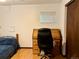 Bedroom with a bed, desk, chair, wooden floors, and natural light from the window at 438 N 11Th Ave, Brighton, CO 80601