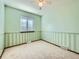 Bedroom featuring soft green walls, a window with blinds, carpeted floors, and a ceiling fan at 438 N 11Th Ave, Brighton, CO 80601