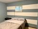 Bedroom featuring a bed, end table, and natural light from the window at 438 N 11Th Ave, Brighton, CO 80601