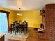 Elegant dining area with a wooden table, stylish chairs, and a cozy fireplace at 438 N 11Th Ave, Brighton, CO 80601