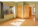 Neutral bedroom with hardwood floors, natural light, and natural wood trim at 31299 Manitoba Dr, Evergreen, CO 80439