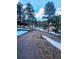 A long driveway leading to a mountain home, surrounded by trees and some snowy patches at 31299 Manitoba Dr, Evergreen, CO 80439