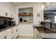 Well-lit kitchen featuring modern appliances, grey countertops, and decorative backsplash at 31299 Manitoba Dr, Evergreen, CO 80439