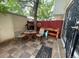 Cozy back patio featuring a stone tile floor, seating area, and wooden work bench at 8624 Mariposa St, Thornton, CO 80260