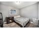 Relaxing bedroom with carpet, electric fireplace, and natural light from the window at 8624 Mariposa St, Thornton, CO 80260