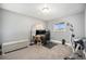 This bedroom comes with large window, carpet, desk and a full workout station at 8624 Mariposa St, Thornton, CO 80260
