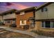 Inviting townhome features well-kept lawn and cozy front entrance at 8624 Mariposa St, Thornton, CO 80260