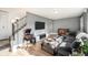 Bright living room showcasing an entertainment center, and sectional sofa at 8624 Mariposa St, Thornton, CO 80260