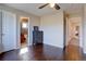 Hardwood floors in this bright bedroom lead to en suite bathroom and hallway at 15960 E Aberdeen Ave, Centennial, CO 80016