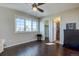 Bedroom boasts hardwood floors, a large window, and en suite bathroom and closet at 15960 E Aberdeen Ave, Centennial, CO 80016