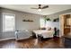 Bright bedroom features hardwood floors, lots of light, ceiling fan, and decor at 15960 E Aberdeen Ave, Centennial, CO 80016