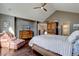 Spacious bedroom featuring hardwood floors, vaulted ceilings, and cozy reading nook with beautiful natural lighting at 15960 E Aberdeen Ave, Centennial, CO 80016