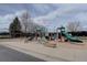 Neighborhood playground featuring slides, swings, and other play equipment for children at 15960 E Aberdeen Ave, Centennial, CO 80016