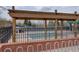 Neighborhood outdoor pool area offering shade and a place for aquatic activities and relaxation at 15960 E Aberdeen Ave, Centennial, CO 80016