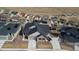 Stunning aerial view of a single-Gathering home displaying well-manicured lawn, modern architecture, and inviting driveway at 17233 W 93Rd Pl, Arvada, CO 80007