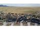 Wide aerial view of homes in a new neighborhood with beautiful mountain views in the distance at 17233 W 93Rd Pl, Arvada, CO 80007