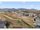 Spacious backyard with a walking path and mountain views in a serene neighborhood setting at 17233 W 93Rd Pl, Arvada, CO 80007