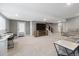 Large finished basement providing ample space for entertainment, a TV, and a walk-out door at 17233 W 93Rd Pl, Arvada, CO 80007