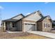 Charming single-Gathering home with stone and siding exterior, a two-car garage, and a well-manicured lawn at 17233 W 93Rd Pl, Arvada, CO 80007