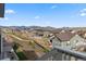 Community view of homes with landscaping, fences, and views of the mountains in the distance at 17233 W 93Rd Pl, Arvada, CO 80007