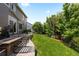 Backyard has a patio with seating and a well-maintained lawn at 20293 E Shady Ridge Rd, Parker, CO 80134
