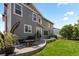 A well-manicured backyard features a patio and lush grass at 20293 E Shady Ridge Rd, Parker, CO 80134