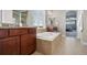 A spacious bathroom offers a soaking tub, shower, and vanity sink at 20293 E Shady Ridge Rd, Parker, CO 80134