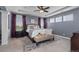 Spacious bedroom featuring a tray ceiling, plush carpet, and gray walls at 20293 E Shady Ridge Rd, Parker, CO 80134