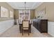 Elegant dining room with modern chandelier, stylish buffet, and neutral tones perfect for entertaining and Gathering meals at 20293 E Shady Ridge Rd, Parker, CO 80134