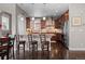 Kitchen featuring a breakfast bar, dark wood cabinets, granite countertops, and modern appliances at 20293 E Shady Ridge Rd, Parker, CO 80134