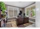 Functional home office with a large desk, ample natural light, and comfortable seating for productive work at 20293 E Shady Ridge Rd, Parker, CO 80134