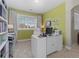 A bright office is furnished with a desk, chair, and shelves at 20293 E Shady Ridge Rd, Parker, CO 80134