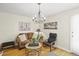 Inviting living room with hardwood floors, chandelier and an abundance of natural light at 6235 E 6Th Avenue Pkwy, Denver, CO 80220