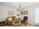 Inviting living room with hardwood floors, chandelier and an abundance of natural light at 6235 E 6Th Avenue Pkwy, Denver, CO 80220
