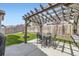 Outdoor patio with pergola, fire pit and green backyard space at 9751 Mobile St, Commerce City, CO 80022