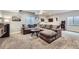 Finished basement area featuring a large sectional sofa and entertainment area at 9751 Mobile St, Commerce City, CO 80022