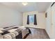 Cozy bedroom with a comfortable bed, window and neutral decor at 9751 Mobile St, Commerce City, CO 80022