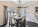Dining room with a table, chairs, hardwood floors and window overlooking the backyard at 9751 Mobile St, Commerce City, CO 80022