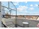 Cozy balcony area with seating offers an inviting space to unwind and enjoy the views at 1845 Kendall St # 325D, Denver, CO 80214