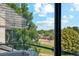 Balcony view overlooking mature trees and an urban street scene, promoting tranquility at 1845 Kendall St # 325D, Denver, CO 80214